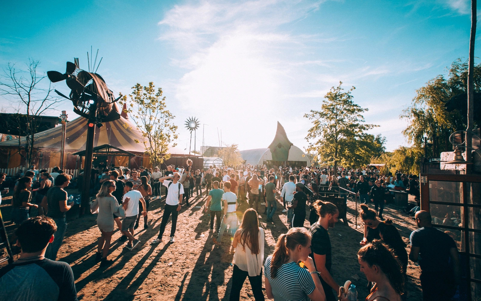 Crowd on the sand in late afternoon sun